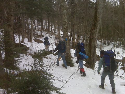In the forest we trekked through some muddy runnoff but also snow.