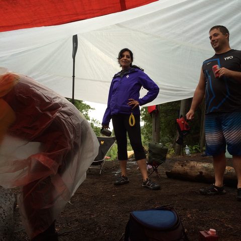 We found we could hold up the tarp if Derek bent over and stuck half a paddle on his back