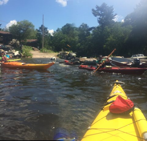 Blake towing another kayak with the gadget pulling up the rear