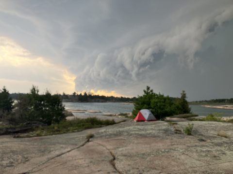 reaching down for Val's tent